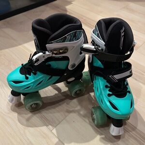 Teal and Black kids Roller Skates used with extra hardware
